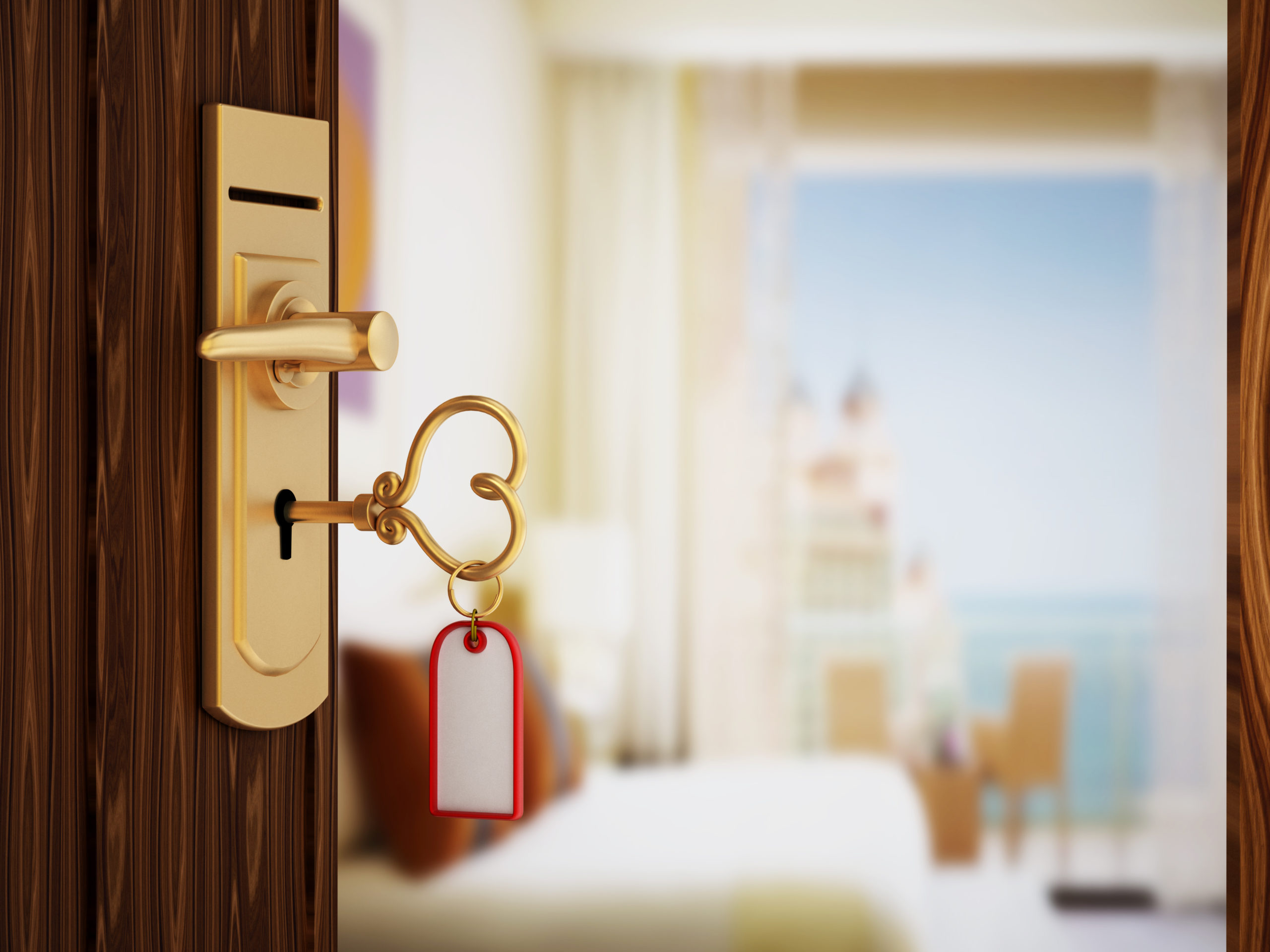 Heart shaped hotel room key on the door